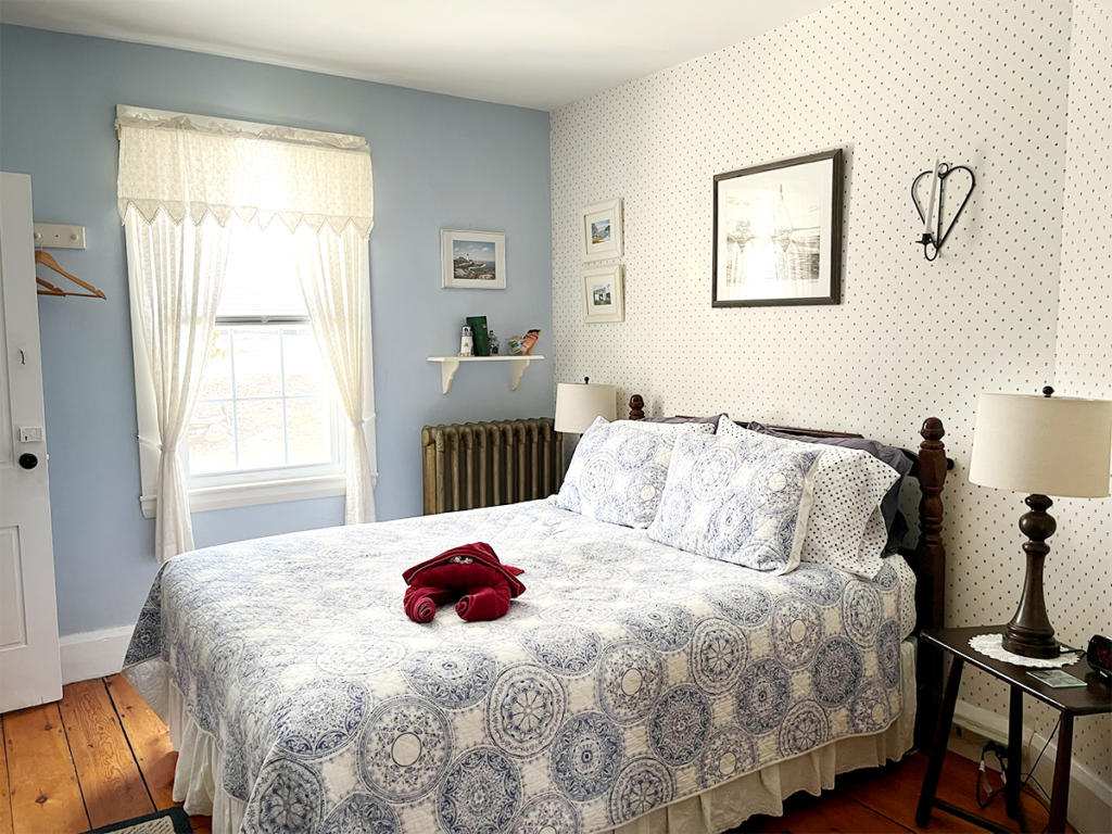 A cozy room, the Clover Room at Candlebay inn is wonderfully appointed with a queen sized bed