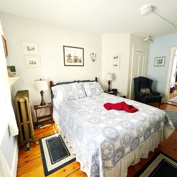 A cozy room, the Clover Room at Candlebay inn is wonderfully appointed with a queen sized bed