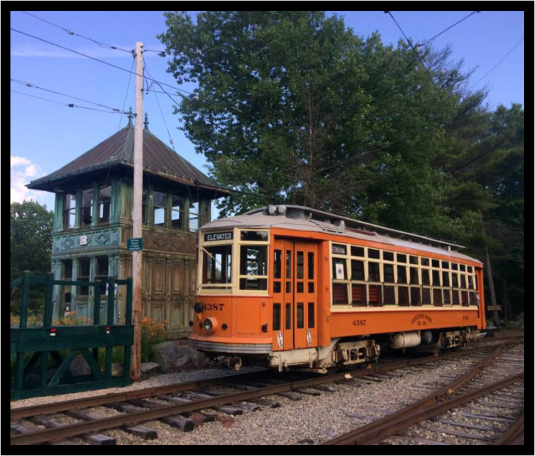 An orange vintage trolley is featured at the Seashore Trolley Museum in Kennebunkport. Maine.